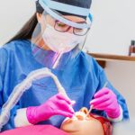Professional dental services featuring modern dental equipment, patient care, oral health assessments, and a clean clinical environment